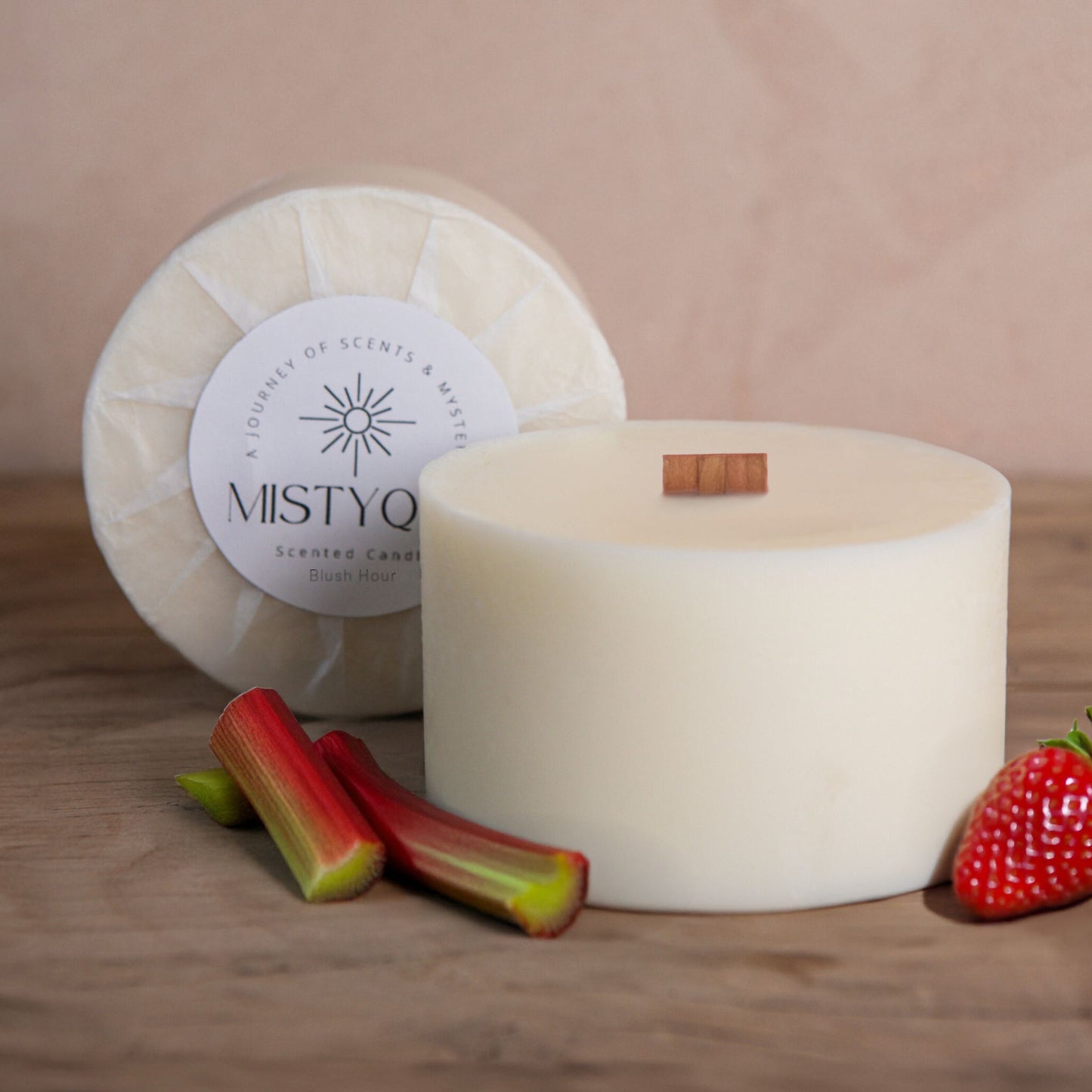 Blush Hour refill candle with strawberries and rhubarb, next to Mistyque wrap