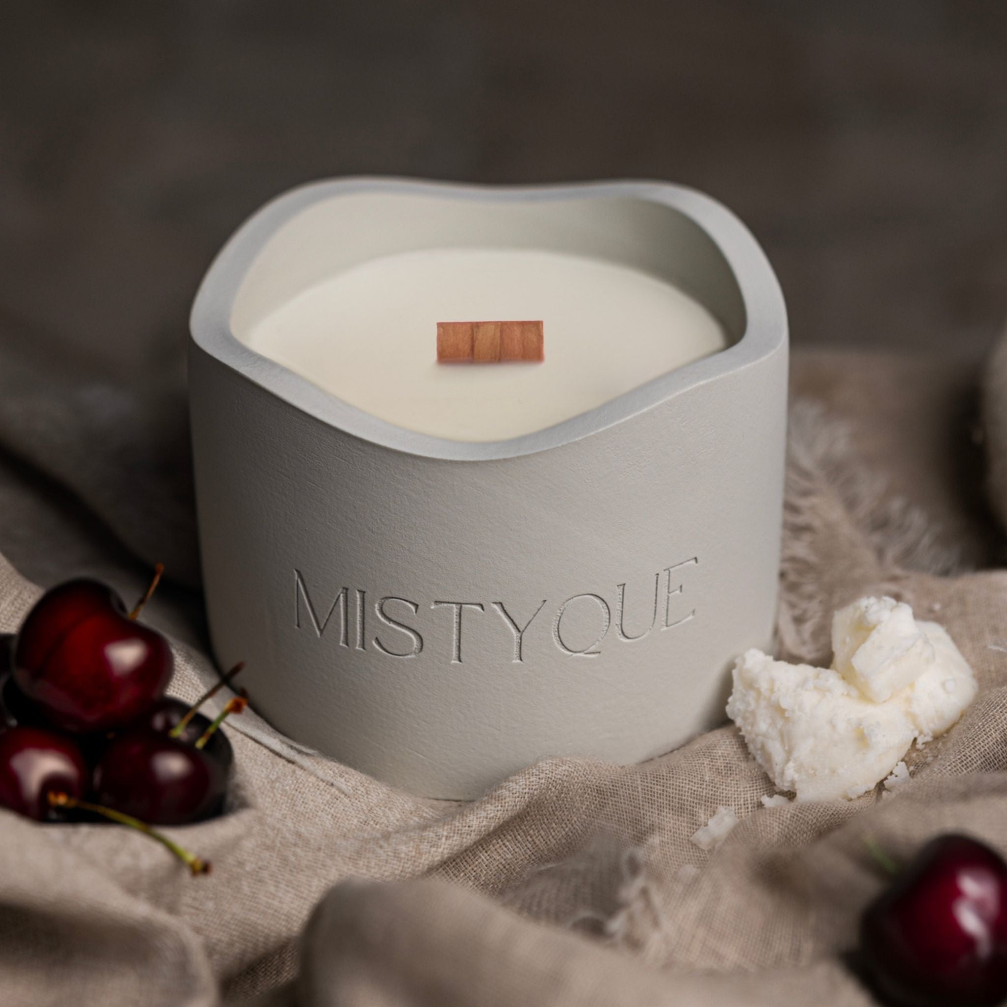 Twilight Cherry refill candle with cherries next to Mistyque wrap